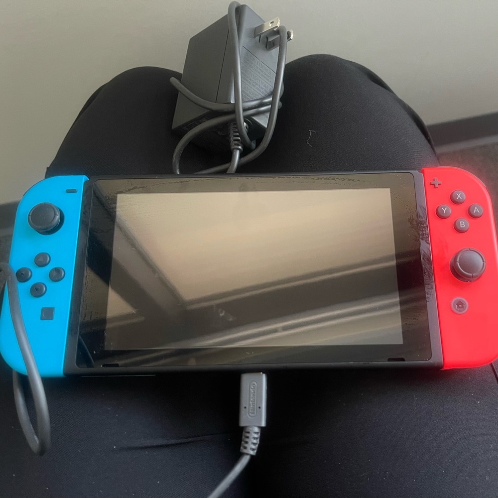 Nintendo switch with accessories red and blue in good condition